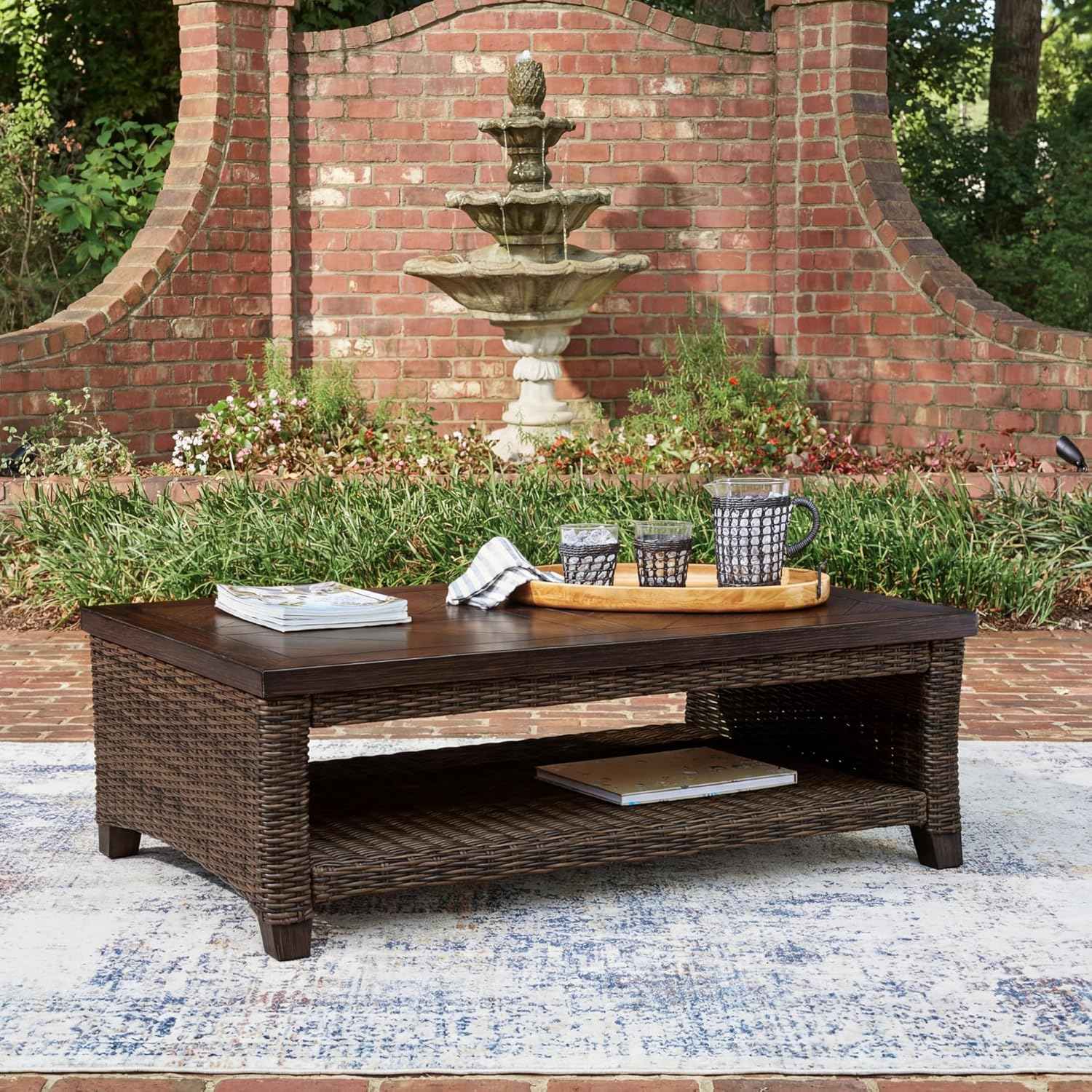 Signature Design by Ashley Drakes Beach Outdoor Coffee Table, Resin Wicker with Aluminum Frame and Wood‑Look Finish for Patio, Deck and Poolside Seating, 48" x 30"